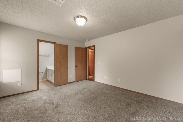 9207 S 92nd E Ave, Tulsa, OK 74133 - unfurnished bedroom with light carpet, a textured ceiling, and ensuite bath