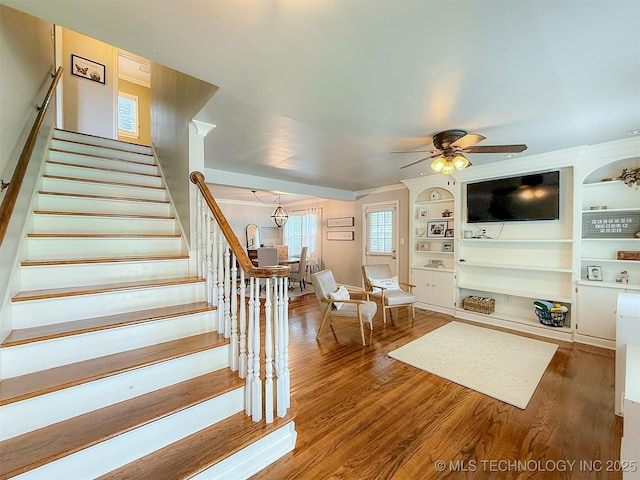 1312 S Oak, Ada, OK 74820 - living area with stairs, wood finished floors, ceiling fan, and built in shelves