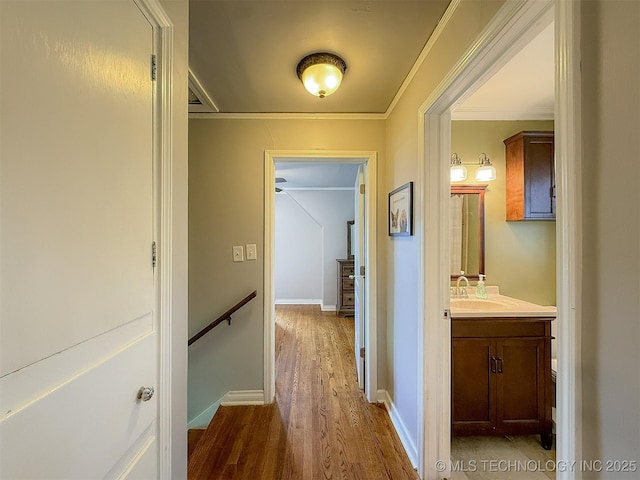 1312 S Oak, Ada, OK 74820 - hallway with wood finished floors and crown molding