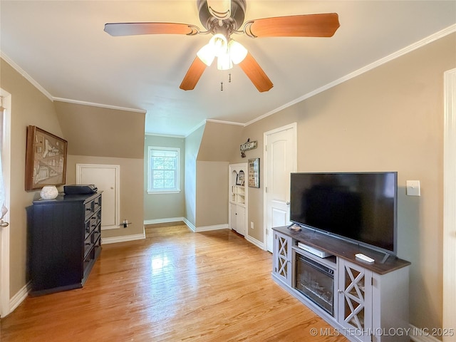 1312 S Oak, Ada, OK 74820 - living area featuring ceiling fan, wood finished floors, and ornamental molding