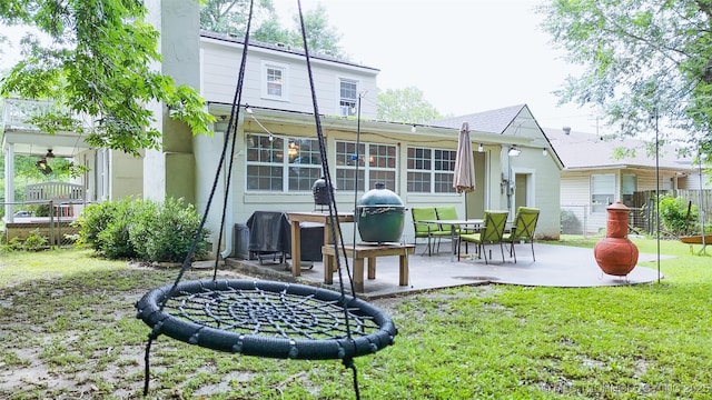 1312 S Oak, Ada, OK 74820 - back of property featuring a yard, a patio area, and stucco siding