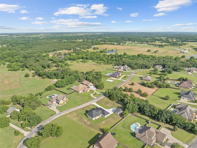 150 Chateau Bnd, Ardmore, OK 73401 - aerial overview of property's location with nearby suburban area and a nearby body of water