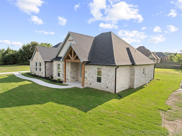 150 Chateau Bnd, Ardmore, OK 73401 - view of front of house with roof with shingles and brick siding
