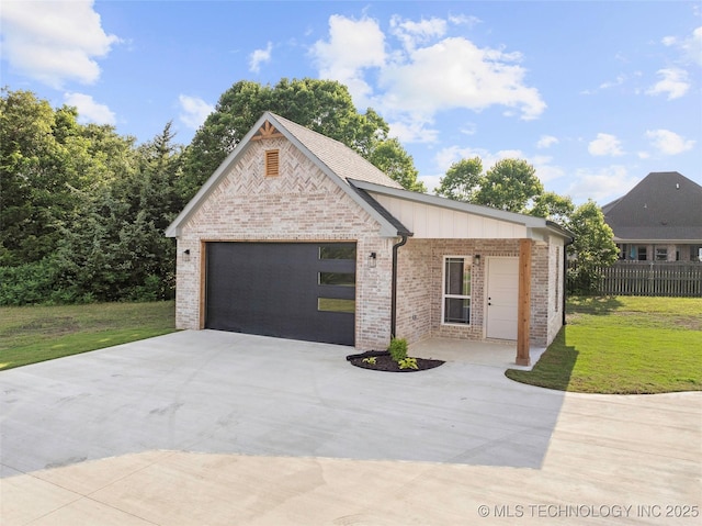 150 Chateau Bnd, Ardmore, OK 73401 - view of front facade with brick siding and driveway