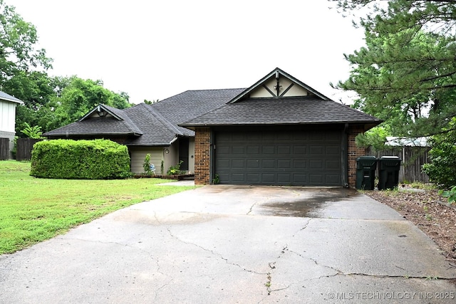 2802 Georgia, Muskogee, OK 74403 - view of front of home featuring brick siding, driveway, a shingled roof, and a garage