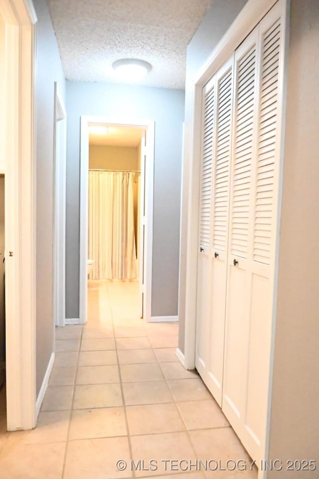 2802 Georgia, Muskogee, OK 74403 - hall featuring light tile patterned floors and a textured ceiling