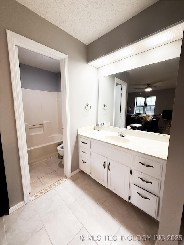 2802 Georgia, Muskogee, OK 74403 - bathroom featuring vanity, tile patterned floors, a textured ceiling, a ceiling fan, and shower / tub combination