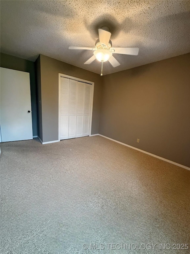2802 Georgia, Muskogee, OK 74403 - unfurnished bedroom featuring a closet, carpet flooring, ceiling fan, and a textured ceiling