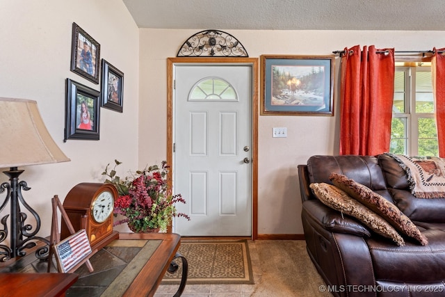 447247 E 70th Rd, Welch, OK 74369 - foyer entrance featuring carpet flooring and a textured ceiling