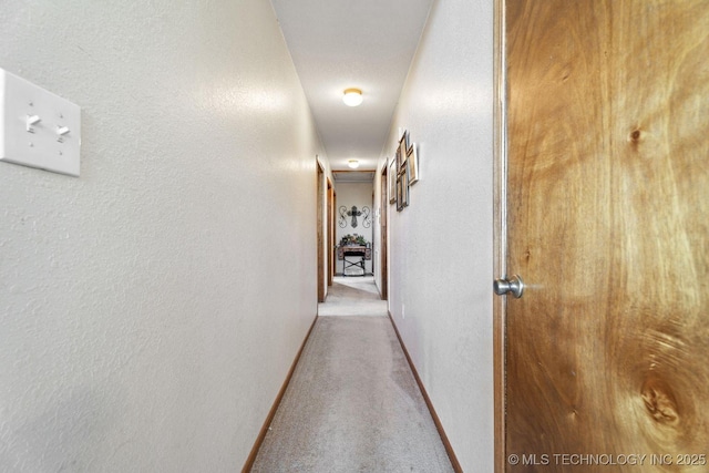 447247 E 70th Rd, Welch, OK 74369 - hallway featuring a textured wall and carpet flooring