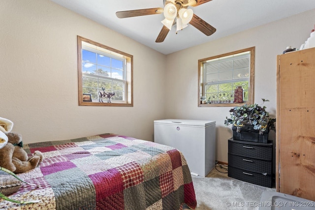 447247 E 70th Rd, Welch, OK 74369 - bedroom featuring refrigerator, carpet flooring, and ceiling fan