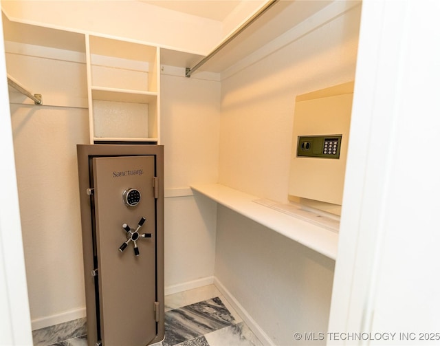 7224 NW 102nd, Oklahoma City, OK 73162 - walk in closet with marble look tiles