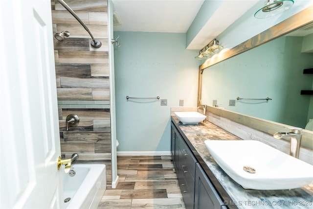 7224 NW 102nd, Oklahoma City, OK 73162 - bathroom with double vanity, shower / bath combination, and wood finished floors
