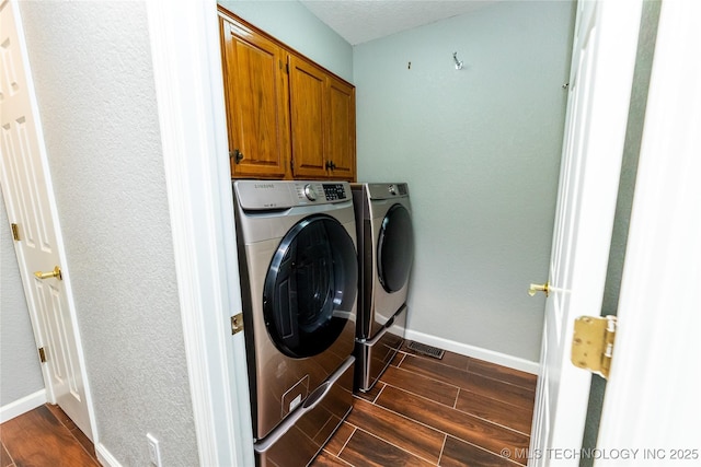 7224 NW 102nd, Oklahoma City, OK 73162 - laundry room with separate washer and dryer, cabinet space, and dark wood finished floors