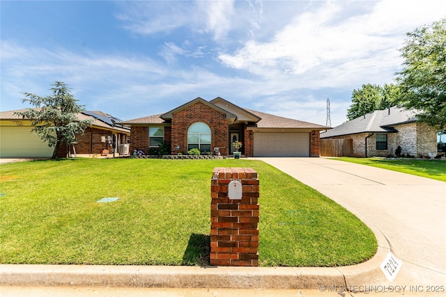 7224 NW 102nd, Oklahoma City, OK 73162 - view of front of house with a garage, brick siding, concrete driveway, a front lawn, and roof with shingles