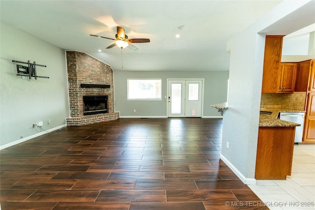 7224 NW 102nd, Oklahoma City, OK 73162 - unfurnished living room featuring ceiling fan, wood tiled floors, a fireplace, and recessed lighting