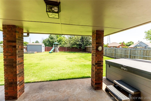 7224 NW 102nd, Oklahoma City, OK 73162 - fenced backyard featuring a patio area, a hot tub, a playground, and a storage shed