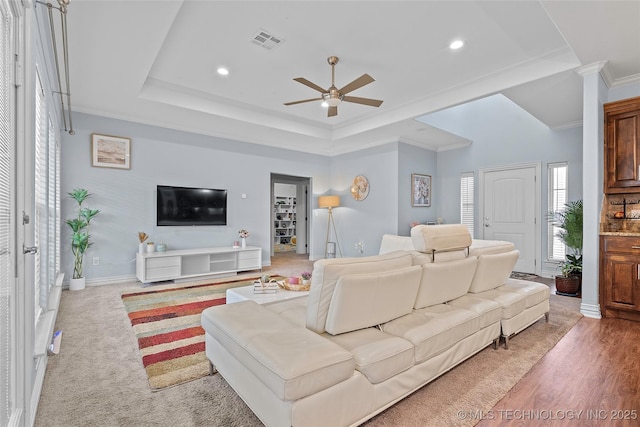 303 Hidden Path, Ardmore, OK 73401 - living room featuring a ceiling fan, recessed lighting, crown molding, and a tray ceiling