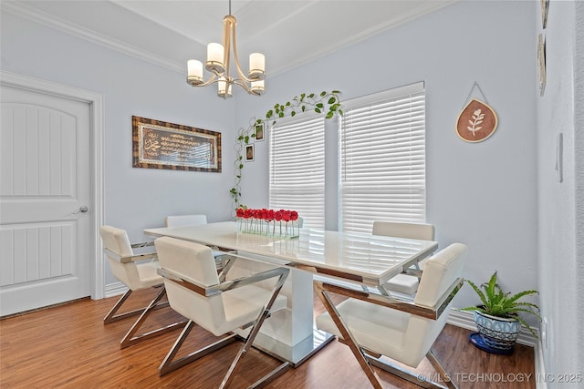 303 Hidden Path, Ardmore, OK 73401 - dining area featuring a chandelier, crown molding, and wood finished floors