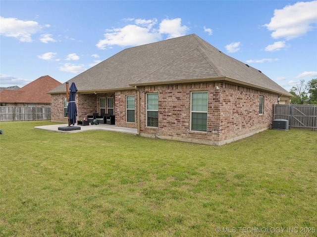 303 Hidden Path, Ardmore, OK 73401 - back of property with brick siding, a fenced backyard, a shingled roof, and a patio area