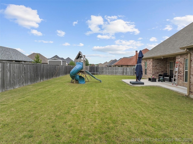 303 Hidden Path, Ardmore, OK 73401 - fenced backyard featuring a playground and a patio area