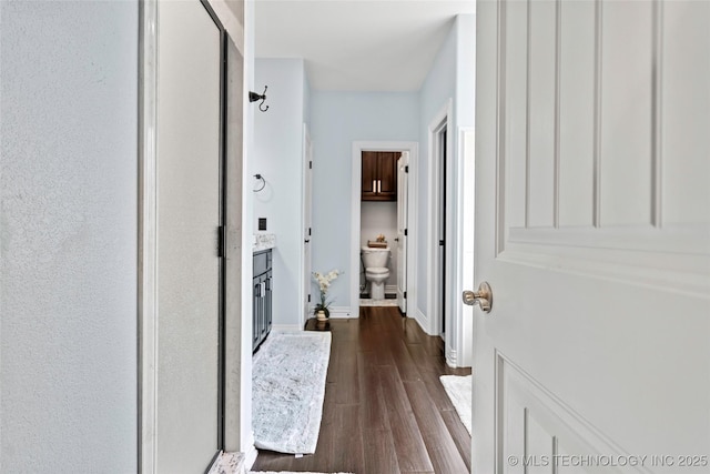 303 Hidden Path, Ardmore, OK 73401 - hall with dark wood-type flooring and baseboards