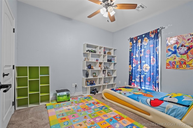 303 Hidden Path, Ardmore, OK 73401 - carpeted bedroom with baseboards and ceiling fan