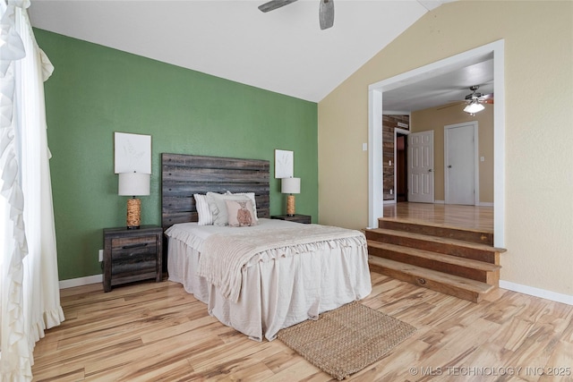 14820 Memorial, Wilson, OK 73463 - bedroom with vaulted ceiling, wood finished floors, and a ceiling fan
