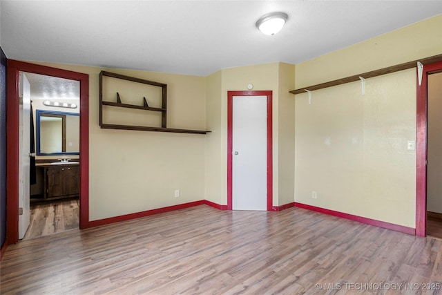 14820 Memorial, Wilson, OK 73463 - unfurnished bedroom featuring wood finished floors and ensuite bath