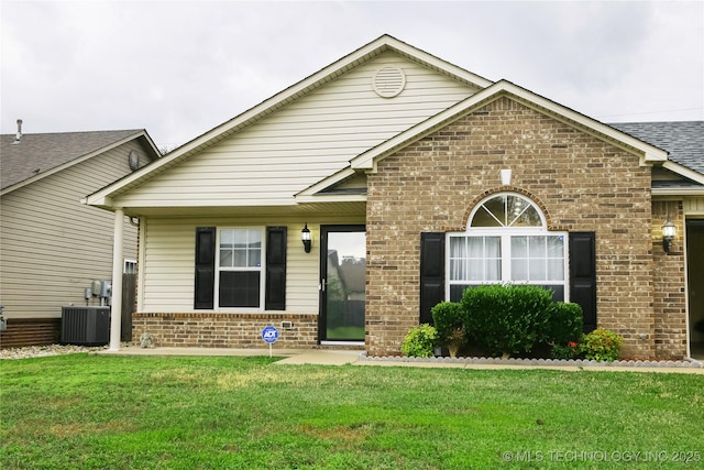614 S Seminole St, Skiatook, OK 74070 - view of front of home with brick siding, a front lawn, and a shingled roof