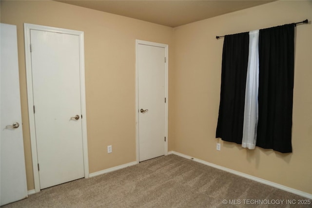 614 S Seminole St, Skiatook, OK 74070 - unfurnished bedroom featuring carpet floors and baseboards
