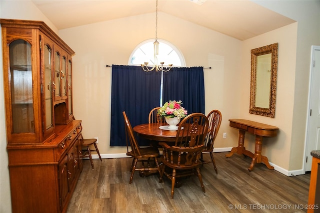 614 S Seminole St, Skiatook, OK 74070 - dining room with a chandelier, dark wood finished floors, and vaulted ceiling