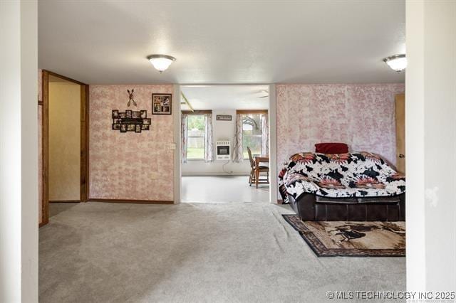 882 Stephens Rd, Eufaula, OK 74432 - carpeted bedroom with wallpapered walls and heating unit