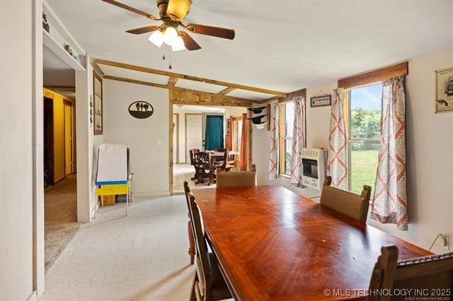 882 Stephens Rd, Eufaula, OK 74432 - dining space featuring heating unit, a ceiling fan, and vaulted ceiling