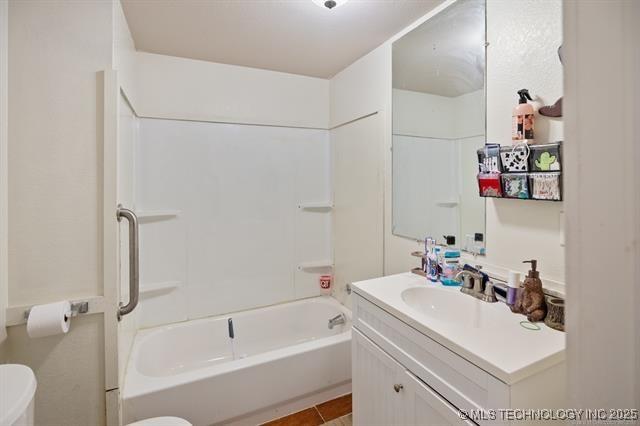 882 Stephens Rd, Eufaula, OK 74432 - bathroom featuring vanity, tub / shower combination, and tile patterned floors