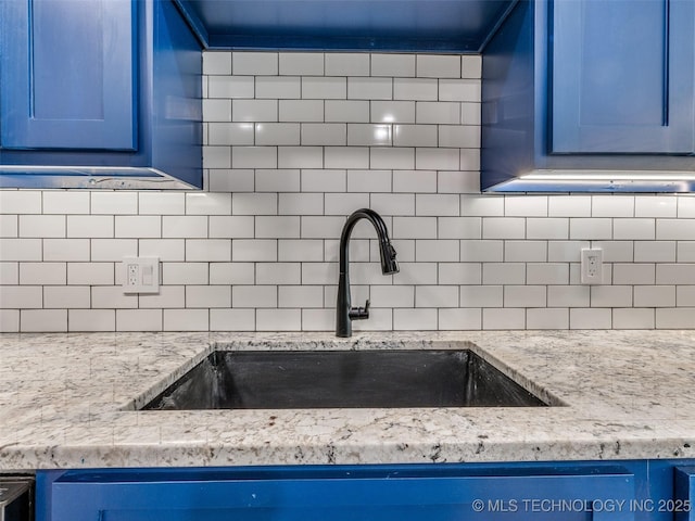 7 Port Duncan Blvd, Afton, OK 74331 - kitchen view of blue cabinets and decorative backsplash