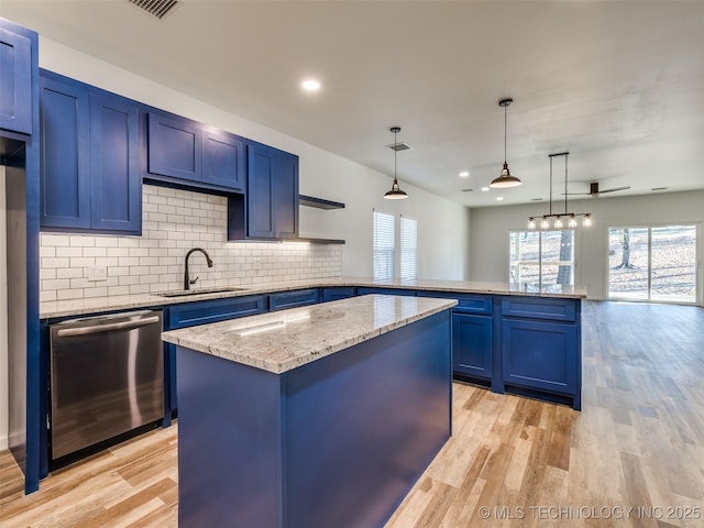 7 Port Duncan Blvd, Afton, OK 74331 - kitchen featuring dishwasher, blue cabinets, a peninsula, and recessed lighting