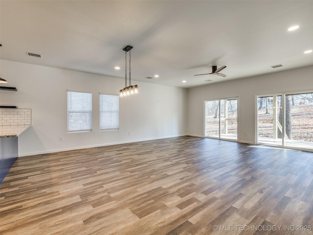 7 Port Duncan Blvd, Afton, OK 74331 - unfurnished living room with ceiling fan, recessed lighting, and wood finished floors