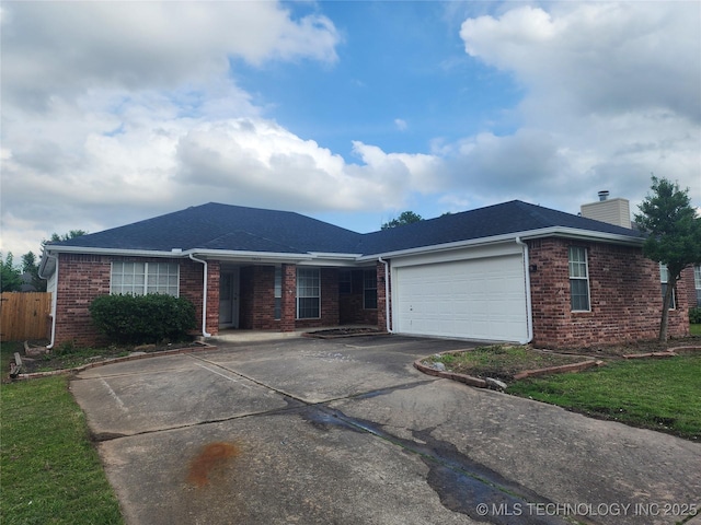 9423 S 88th Ave E, Tulsa, OK 74133 - ranch-style house with brick siding, driveway, a chimney, and a garage