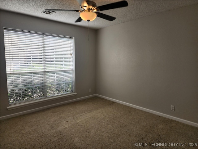 9423 S 88th Ave E, Tulsa, OK 74133 - carpeted empty room featuring plenty of natural light, ceiling fan, and a textured ceiling