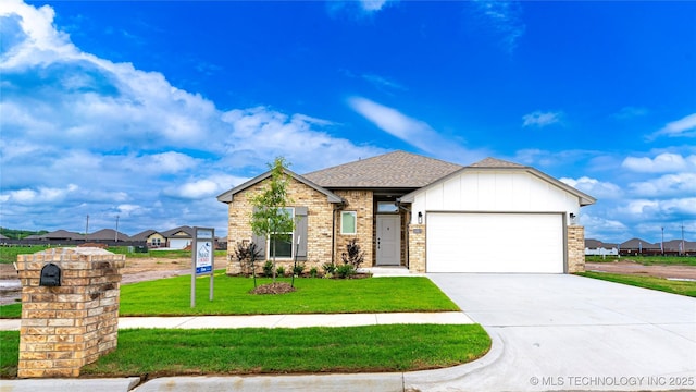 10917 S 271st E Ave, Coweta, OK 74429 - view of front of home featuring an attached garage, concrete driveway, a front yard, roof with shingles, and board and batten siding