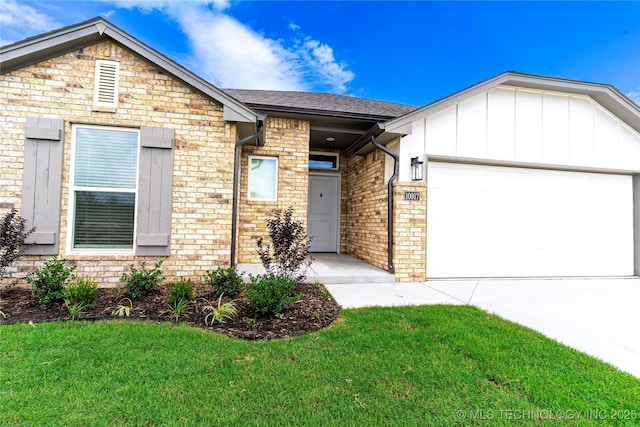 10917 S 271st E Ave, Coweta, OK 74429 - view of front of property with an attached garage, a front lawn, concrete driveway, and board and batten siding