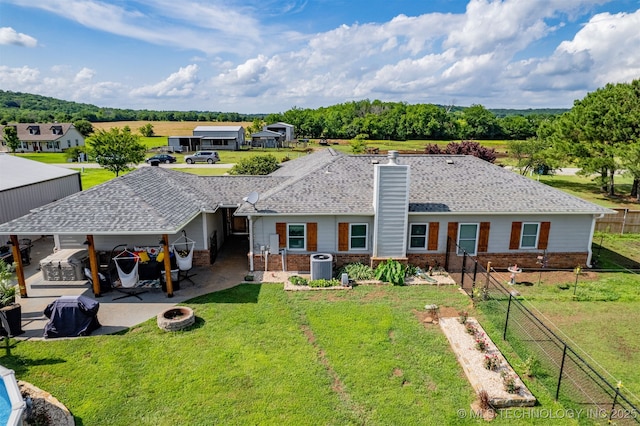 20672 E Kambrie St, Inola, OK 74036 - rear view of house featuring brick siding, a chimney, and a patio area