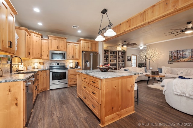 20672 E Kambrie St, Inola, OK 74036 - kitchen featuring stainless steel appliances, a ceiling fan, light brown cabinets, a kitchen breakfast bar, and ornamental molding