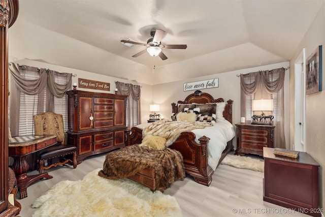20672 E Kambrie St, Inola, OK 74036 - bedroom with wood finished floors, vaulted ceiling, ceiling fan, and a raised ceiling