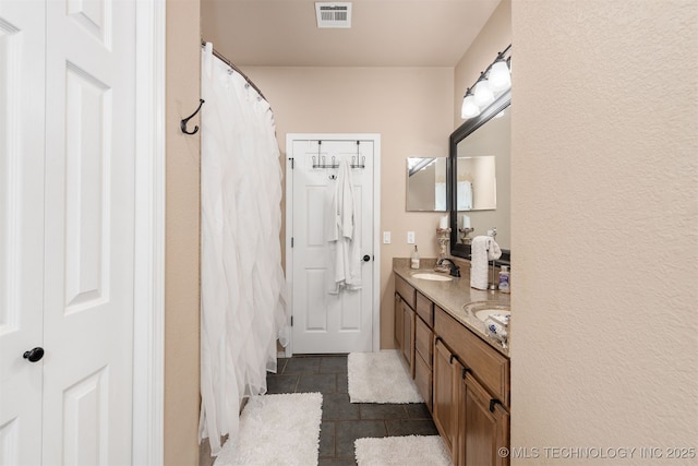 20672 E Kambrie St, Inola, OK 74036 - bathroom with double vanity, tile patterned flooring, and a shower with shower curtain