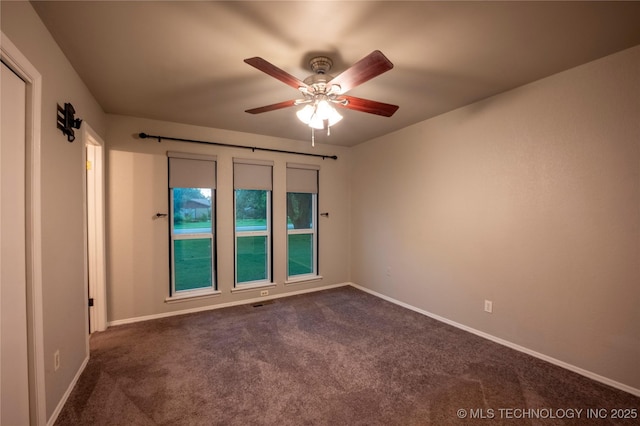 12922 S 123rd E Ave, Broken Arrow, OK 74011 - empty room featuring dark carpet and ceiling fan