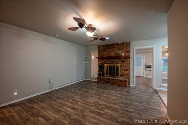 12922 S 123rd E Ave, Broken Arrow, OK 74011 - unfurnished living room with dark wood-type flooring, ceiling fan, and a brick fireplace