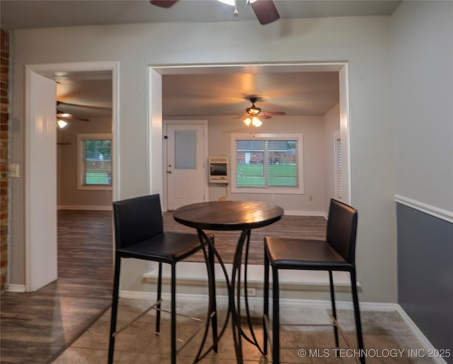 12922 S 123rd E Ave, Broken Arrow, OK 74011 - dining area featuring a ceiling fan, wood finished floors, and healthy amount of natural light