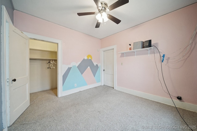1414 E 8th St, Okmulgee, OK 74447 - unfurnished bedroom with carpet floors, ceiling fan, and a closet